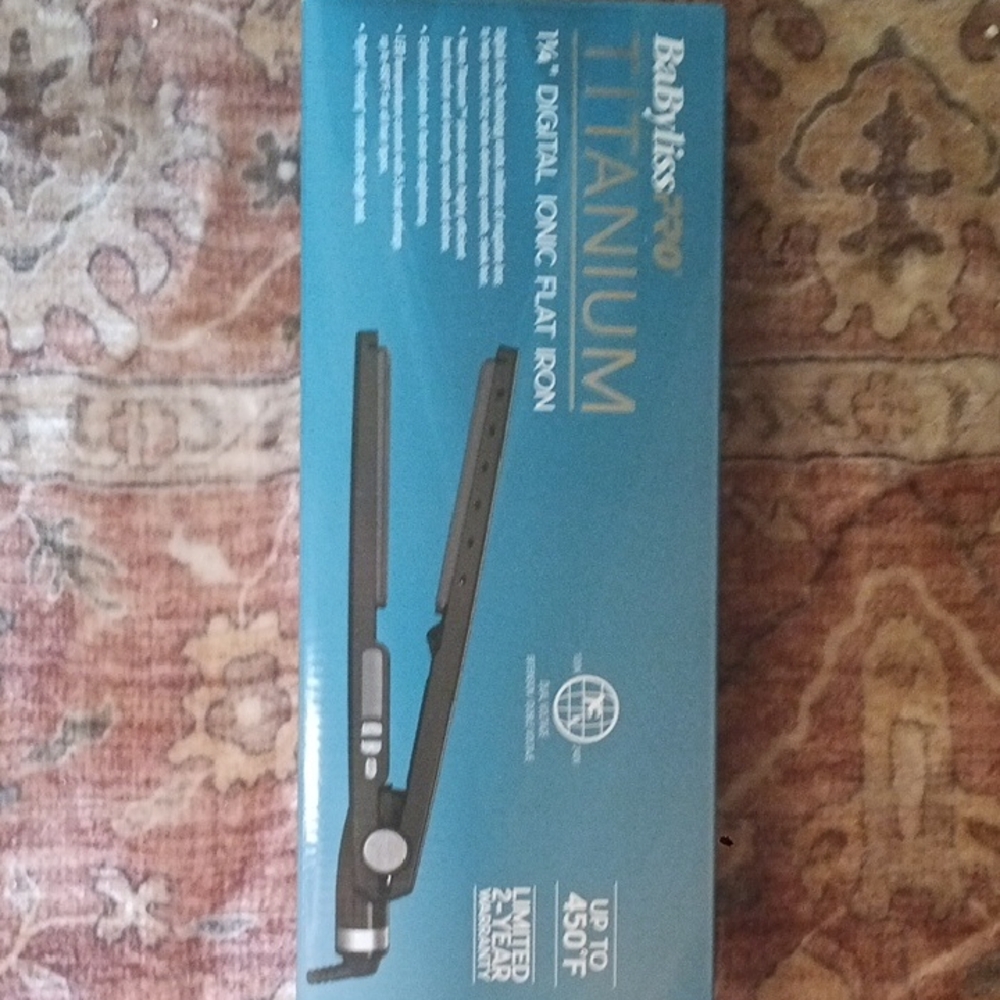 BaByliss 1 1/4" blk Titanium Flat Iron in Teal and Gold Packaging